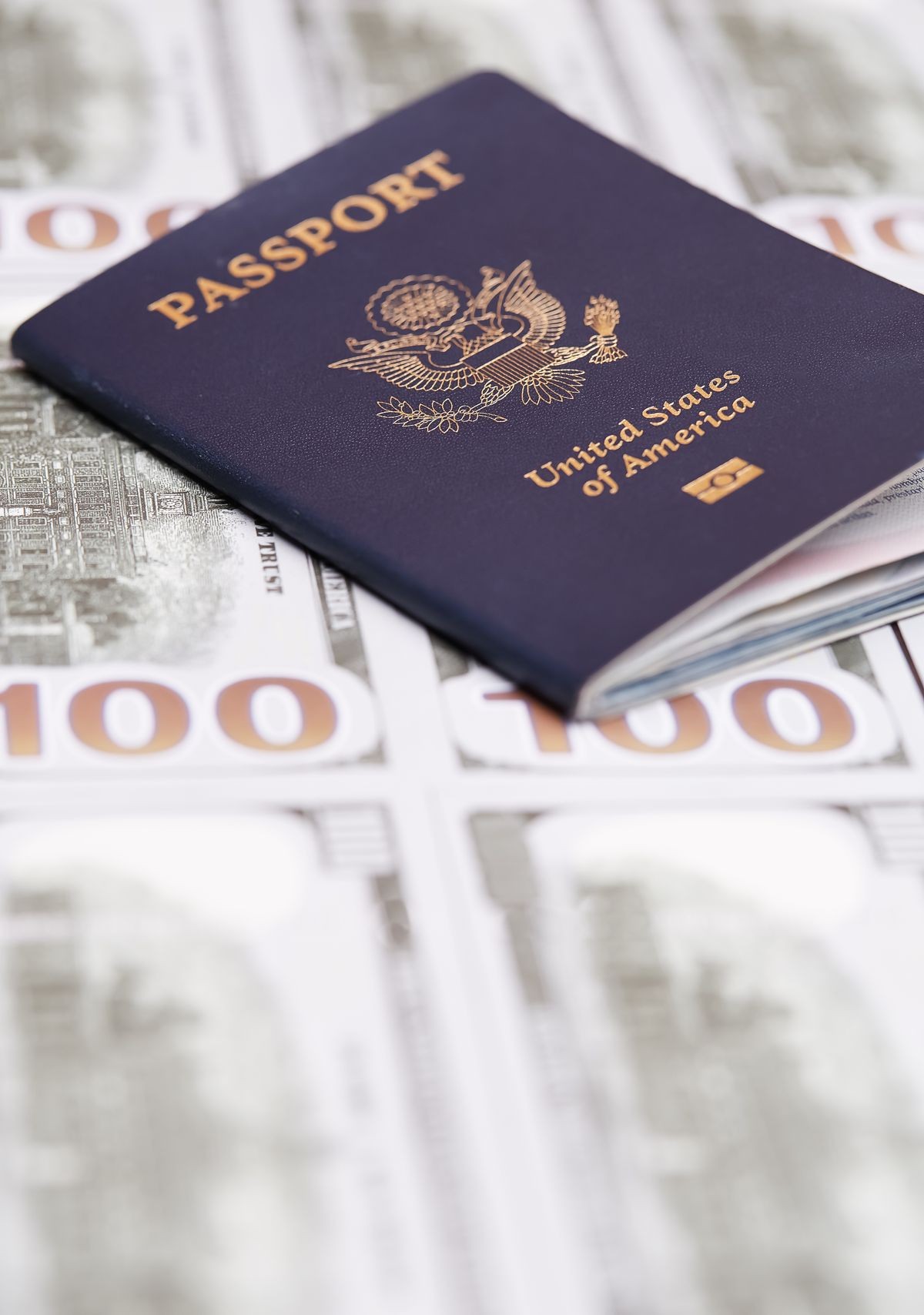 us passport and dollars banknotes. money and travel concept.
